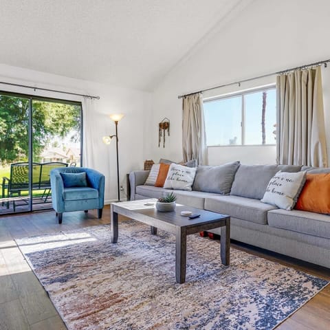 Our living room boasts ample natural light  and extra large sofa.