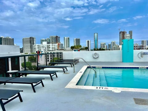 Outdoor pool, pool umbrellas, sun loungers