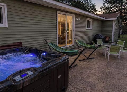 Unwind out back in the hot tub, hammocks, or take a seat at the table. 