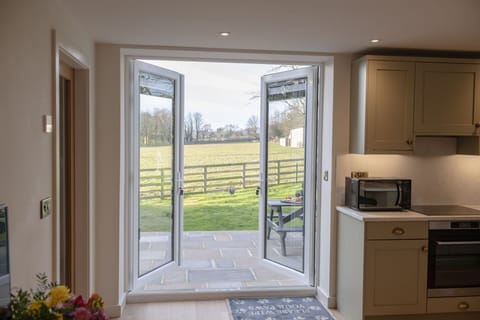 The Dog Kennels, Leyburn: French doors leading out onto the patio