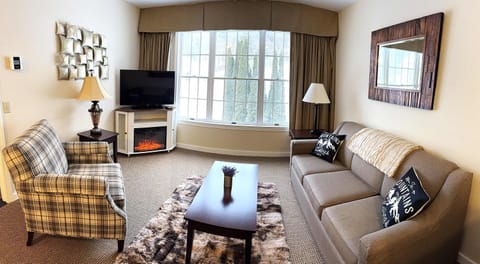Stylish, and comfortable Mountain Decor.  Couch opens up to a QUEEN sofa bed