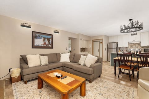 Unwind on your spacious sectional after mountain adventures, with a fully-equipped kitchen ready for home-cooked meals in this cozy mountain retreat.
