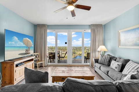 Relax in this modern living room with balcony views of the outdoors.