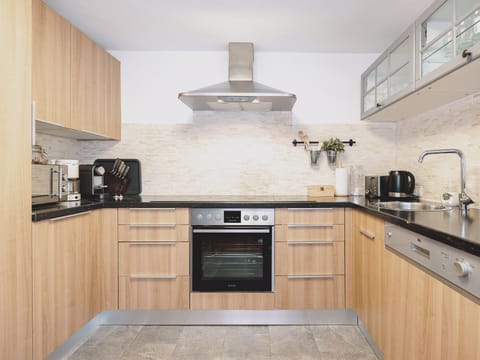 Deluxe Chalet, Mountain View | Private kitchen | Electric kettle, toaster, highchair