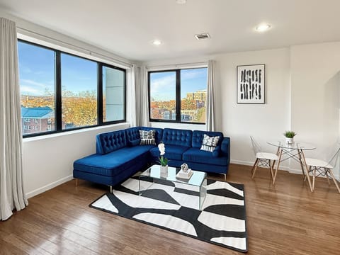 Contemporary Livingroom:
- Sofa
- Blackout curtains 
- City View
- 65" Smart TV