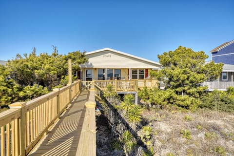Our beach house is nestled between coastal pines, facing south towards the beach
