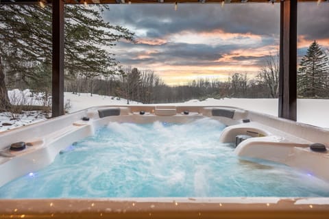 Relax in a 7-person jacuzzi with dual jets and sunset views after outdoor fun.