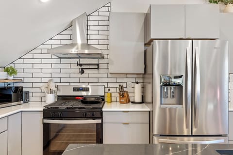 Cook up a feast in this fully stocked kitchen, equipped with modern appliances 