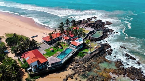 On the beach, white sand, sun loungers, beach umbrellas