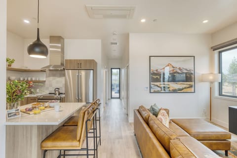 Open-concept living and kitchen with island seating.