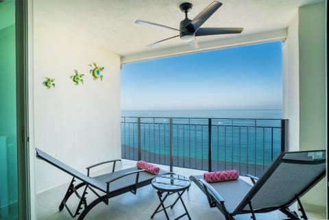You can choose to set up either the lounge chairs or the outdoor sofas on the balcony to enjoy the view