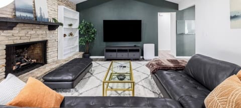 Relax in the living room with cozy seating and a massage chair—perfect after exploring Austin’s South Congress dining, shopping, and nightlife just minutes away.