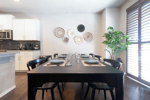 Spacious dining area, open kitchen, and living space.