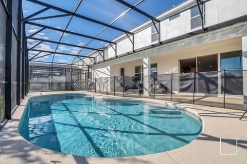 Relax in your private screened pool oasis, perfect for unwinding under the sun in complete privacy.