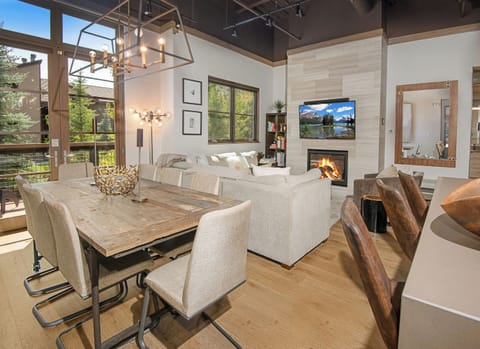 Modern Mountain Escape - Dining Space, Breakfast Bar, and Living Room with Cozy Fireplace