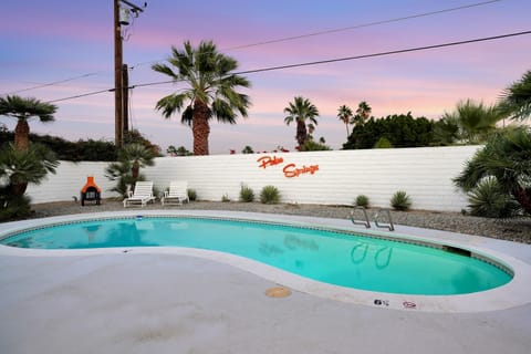 A private backyard oasis with pool and outdoor seating
