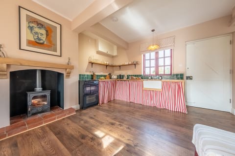 Ground floor: Kitchen area with wood burning stove
