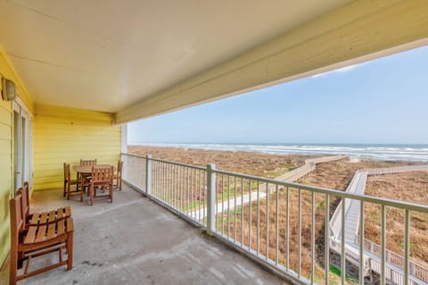 Sip your morning coffee on this ocean-view balcony, where endless waves and coastal dunes create your perfect seaside retreat.