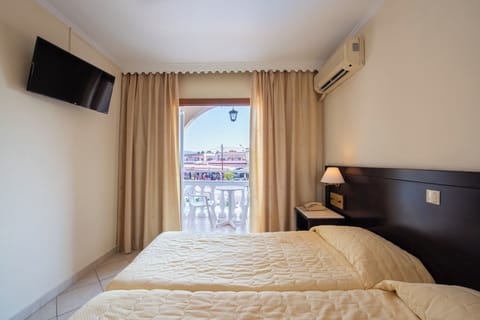 Classic Twin Room, Balcony, Pool View | In-room safe, desk, iron/ironing board, free WiFi