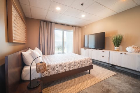 One queen bed and large TV.