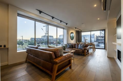 Sink into your leather lounges and watch the city come alive through floor-to-ceiling windows—this is where your evenings unfold.