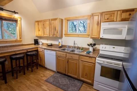 Deluxe Cabin | Living area | 47-inch Smart TV with satellite channels