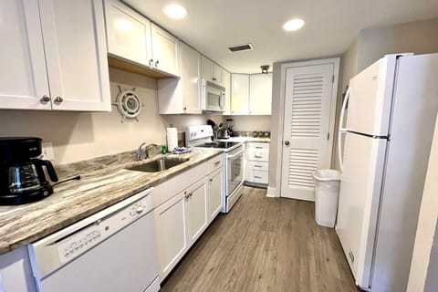 Renovated kitchen with granite counters.