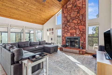 Accented with high vaulted wood ceilings and hardwood floors throughout