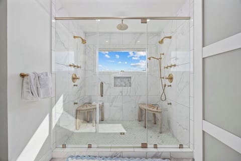 Let natural light transform your bathing experience! This beautifully designed bathroom with a shower and a window invites tranquility and freshness into your daily routine.