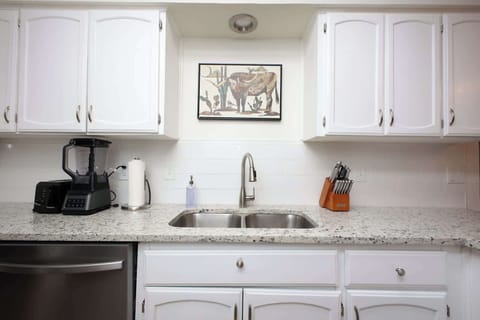 Featuring high-end appliances and ample cabinetry for all your culinary needs. 