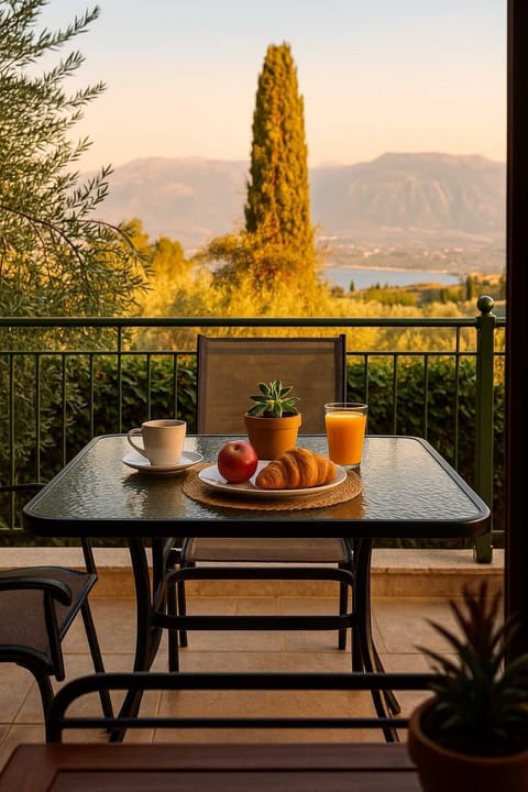 Balcony with a Sea & Valley Views – Enjoy your morning coffee overlooking the peaceful garden and distant landscape.