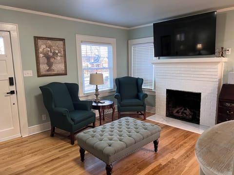 Relaxing living room with smart tv and gas log fireplace.