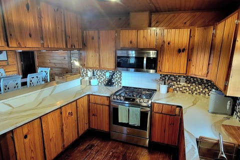 Large kitchen with plenty of counter and cabinet space. Fully stocked!