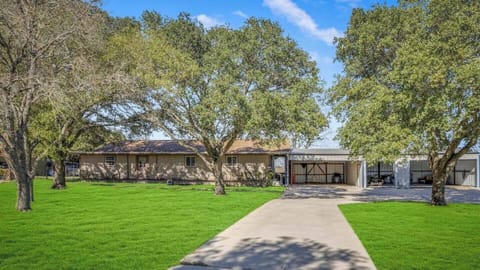 Enjoy the fully fenced flat front yard with shaded areas for all to enjoy.