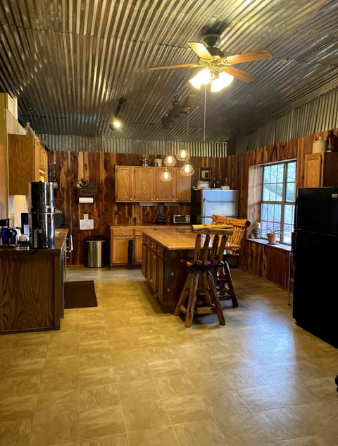 Large, well stocked kitchen w/ electric stove, dishwasher, and large fridge.