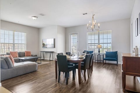 - Spacious, open-concept living & dining area designed for relaxation - Large windows fill the room with natural light, complemented by tasteful decor & cozy seating - Perfect for hosting dinners, watching movies, or creating cherished memories