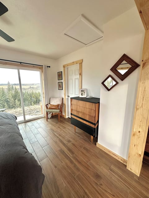 Sliding glass door to backyard. Dresser for storage.