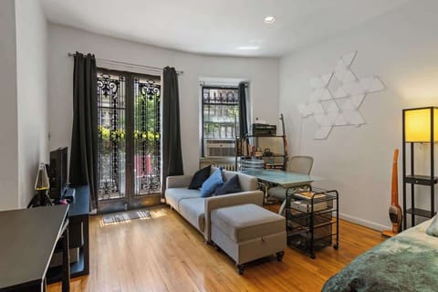 Bright living area with a comfy sofa and chic decor.
