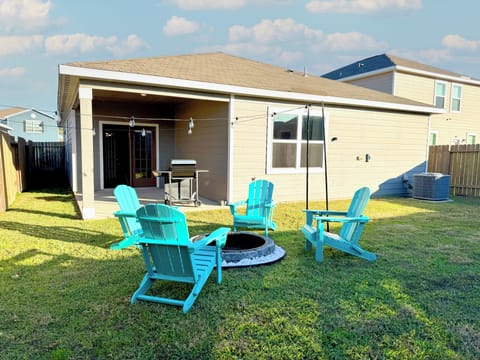 Fire pit in a fully fenced backyard