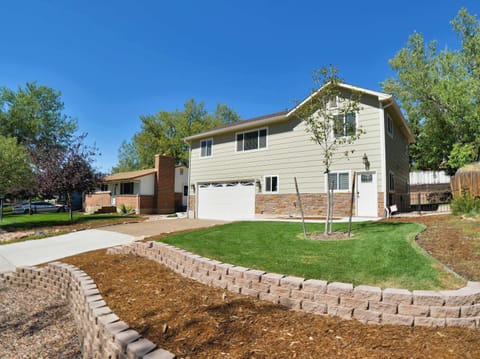 Welcome to Crestview Place! A spacious and inviting home with a beautifully landscaped yard and ample driveway parking.