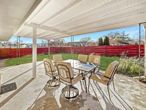 Covered patio in fenced yard
