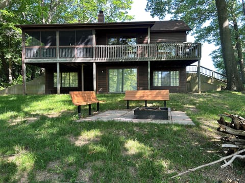 Rear view with firepit overlooking river
