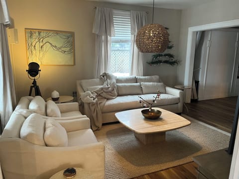 Cozy living room with 65 inch TV and gas fireplace 