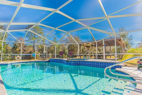 Pool and hot tub combo along with seating for all.