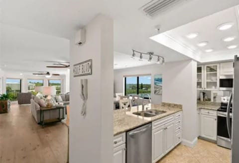 Kitchen has dishes, pots, utensils and all small and large appliances.