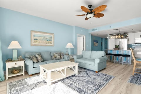 Relax in this coastal-inspired living room with comfortable seating and natural light.
