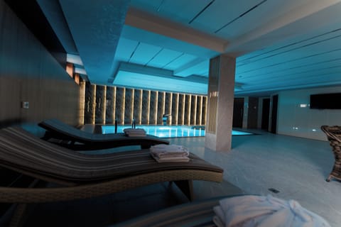 Indoor pool, seasonal outdoor pool, pool umbrellas, sun loungers