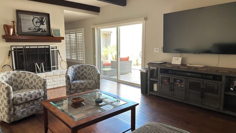 Bright living room leading to private courtyard