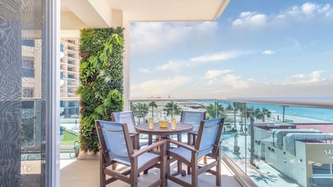 The dining table at the corner of the wrap around balcony.