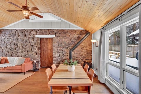Rustic Farmhouse Dining Area with Wood Ceiling & Natural Light